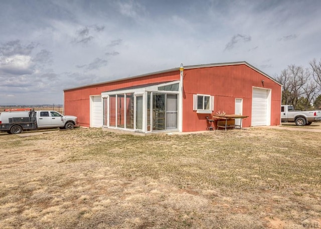 11210 Eggar Dr, Peyton, CO 80831 - rear view of property with a lawn