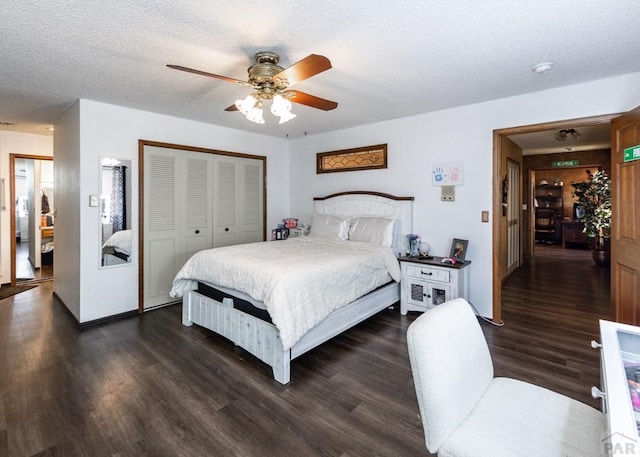 11210 Eggar Dr, Peyton, CO 80831 - bedroom with dark wood-style floors, a closet, and a textured ceiling