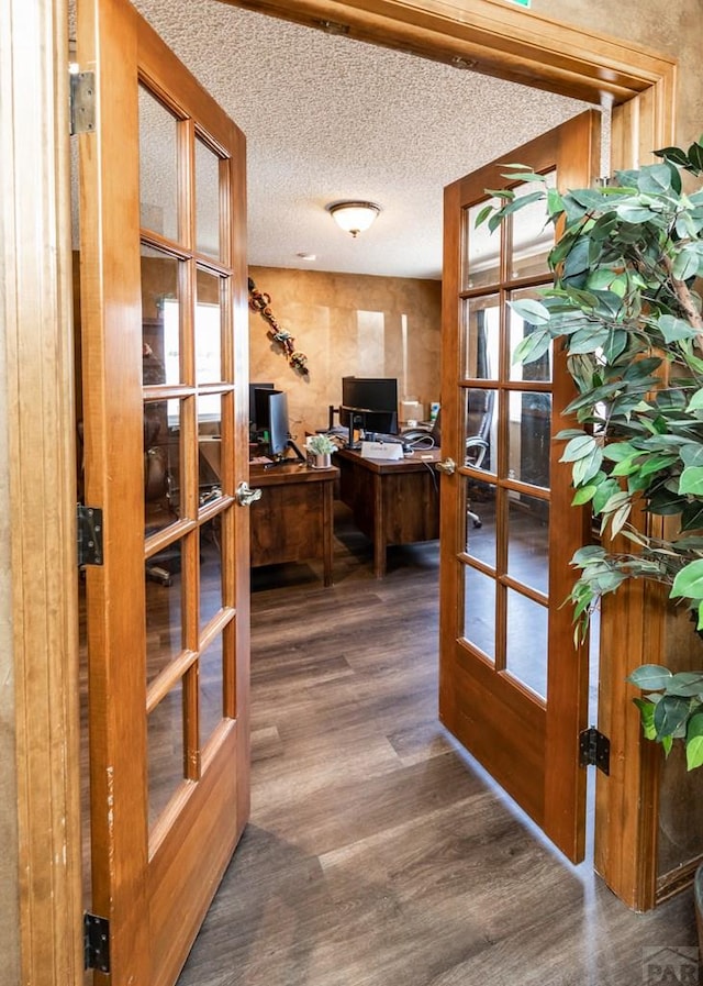 11210 Eggar Dr, Peyton, CO 80831 - office area featuring french doors, a textured ceiling, and wood finished floors
