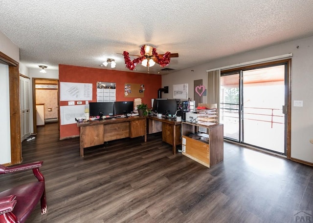 11210 Eggar Dr, Peyton, CO 80831 - office space featuring dark wood finished floors, a textured ceiling, baseboard heating, and a ceiling fan