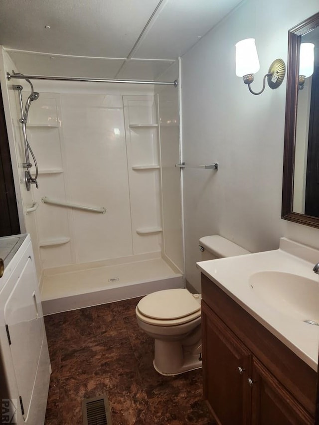 5000 Red Creek Springs Rd Unit 33, Pueblo, CO 81005 - bathroom with vanity, washer / clothes dryer, a shower, and stone finish floors