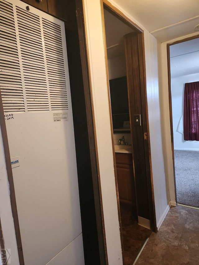 5000 Red Creek Springs Rd Unit 33, Pueblo, CO 81005 - corridor featuring a heating unit and a sink