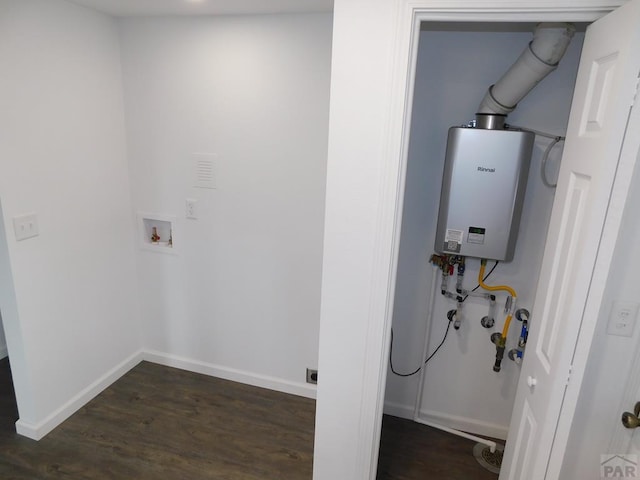 laundry area featuring laundry area, baseboards, dark wood-style flooring, hookup for a washing machine, and tankless water heater