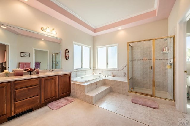 full bathroom with a raised ceiling, ornamental molding, tile patterned flooring, and a sink