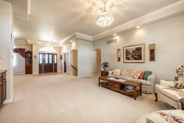 living area featuring ornamental molding, light colored carpet, visible vents, and baseboards