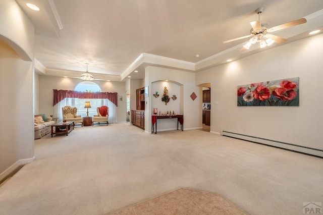 carpeted living area featuring arched walkways, baseboards, and recessed lighting