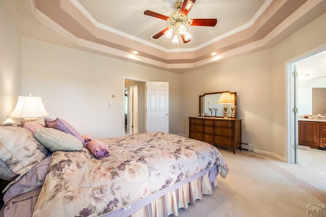 bedroom with a baseboard heating unit, a tray ceiling, light colored carpet, and ornamental molding