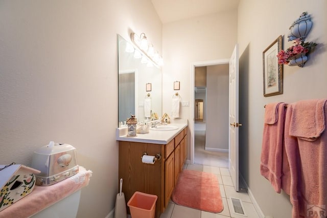 bathroom with tile patterned flooring, visible vents, baseboards, and vanity