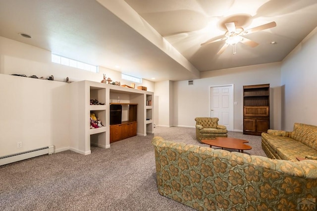 carpeted living room featuring ceiling fan, visible vents, baseboard heating, and baseboards