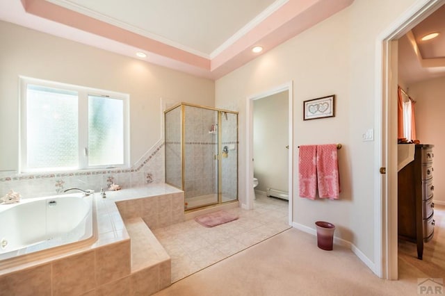 full bathroom with ornamental molding, a tray ceiling, a garden tub, and a shower stall