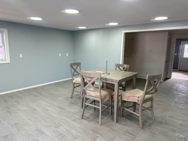 dining space with recessed lighting and baseboards