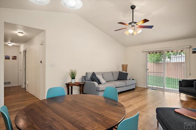 4315 Outlook Blvd Unit L, Pueblo, CO 81008 - living area with lofted ceiling, wood finished floors, ceiling fan, and baseboards