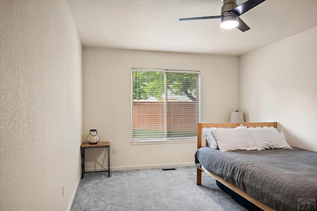 4315 Outlook Blvd Unit L, Pueblo, CO 81008 - carpeted bedroom featuring baseboards and a ceiling fan