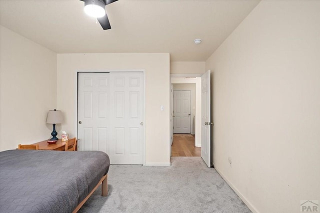 4315 Outlook Blvd Unit L, Pueblo, CO 81008 - carpeted bedroom with baseboards, a closet, and ceiling fan