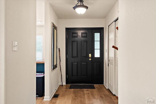 4315 Outlook Blvd Unit L, Pueblo, CO 81008 - foyer entrance with wood finished floors and baseboards