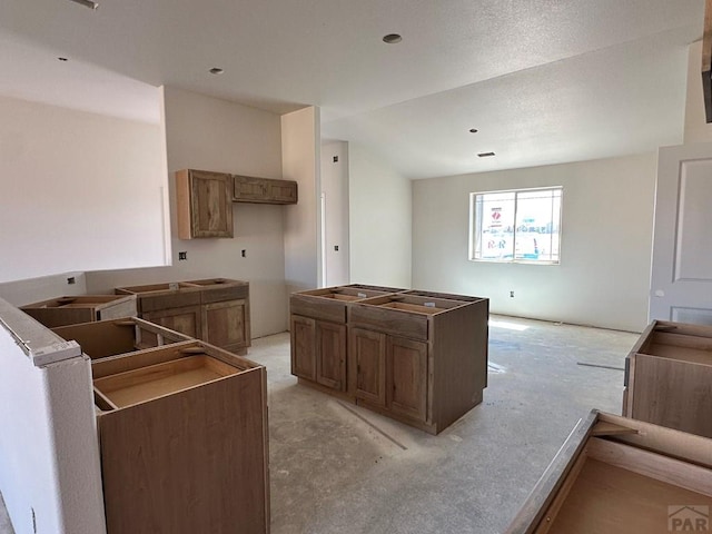 5400 Darter Ct, Pueblo, CO 81008 - kitchen featuring a center island and light colored carpet