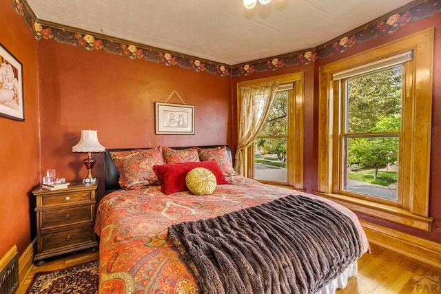 326 W Pitkin Ave, Pueblo, CO 81004 - bedroom featuring wood finished floors and baseboards
