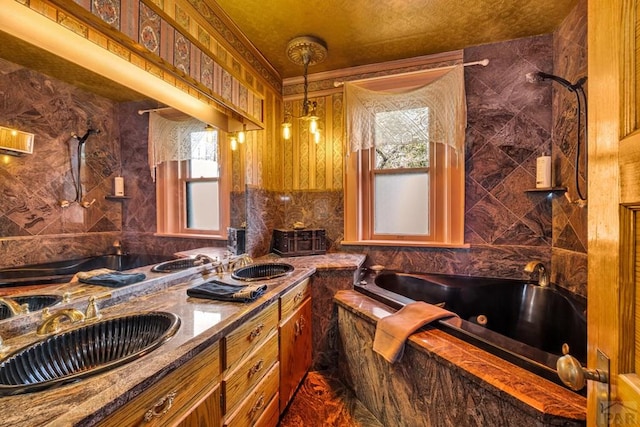 326 W Pitkin Ave, Pueblo, CO 81004 - bathroom with plenty of natural light, a jetted tub, double vanity, and a shower