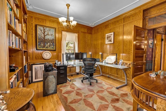 326 W Pitkin Ave, Pueblo, CO 81004 - office with a chandelier, light wood-style floors, wooden walls, and crown molding