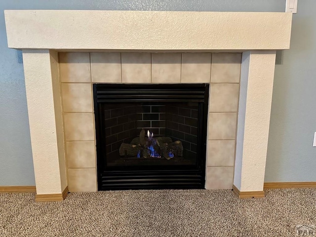 details with carpet flooring, a fireplace, and baseboards