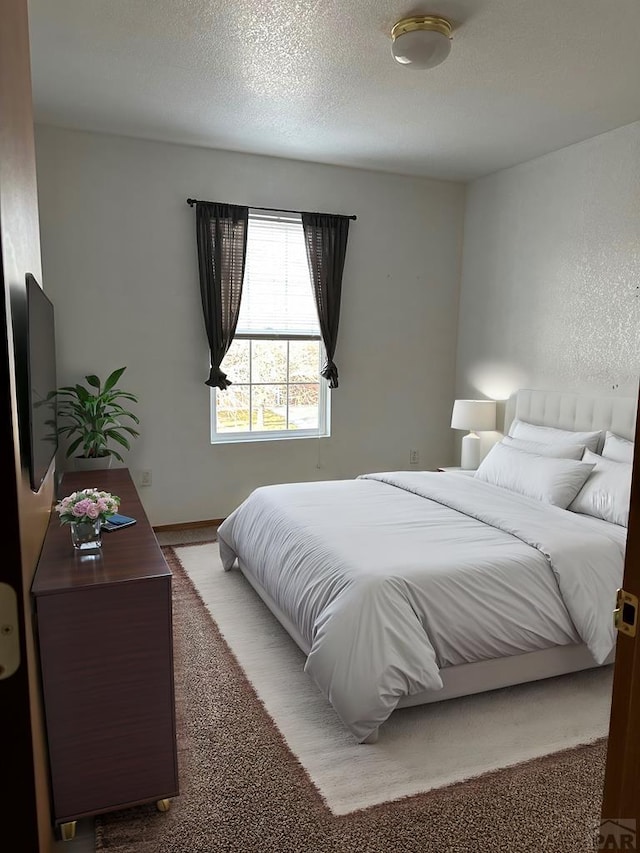 bedroom featuring a textured ceiling