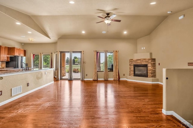 368 S Camino De Los Ranchos, Pueblo West, CO 81007 - unfurnished living room featuring vaulted ceiling, ceiling fan, wood finished floors, plenty of natural light, and recessed lighting