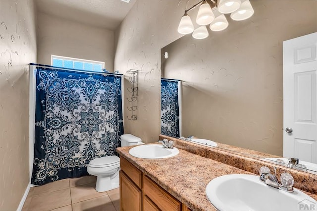 368 S Camino De Los Ranchos, Pueblo West, CO 81007 - bathroom featuring double vanity, tile patterned flooring, a shower with shower curtain, and a chandelier