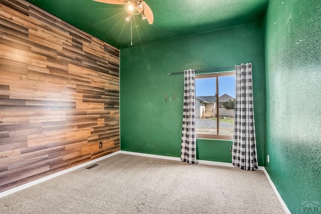 368 S Camino De Los Ranchos, Pueblo West, CO 81007 - carpeted spare room featuring ceiling fan and a textured wall