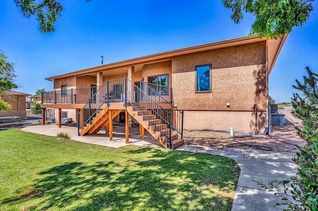 368 S Camino De Los Ranchos, Pueblo West, CO 81007 - back of house featuring stairway, a patio area, and stucco siding