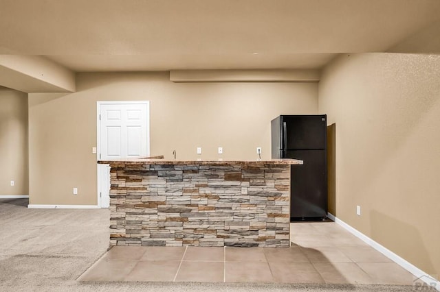 368 S Camino De Los Ranchos, Pueblo West, CO 81007 - kitchen featuring freestanding refrigerator and baseboards