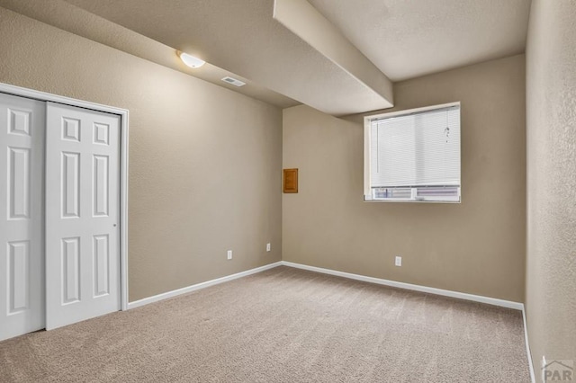 368 S Camino De Los Ranchos, Pueblo West, CO 81007 - empty room with carpet and a textured wall