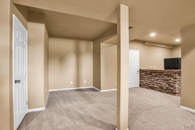 368 S Camino De Los Ranchos, Pueblo West, CO 81007 - below grade area featuring carpet, black fridge, a textured ceiling, and recessed lighting