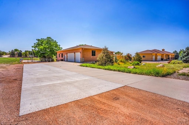 368 S Camino De Los Ranchos, Pueblo West, CO 81007 - ranch-style house featuring a detached garage