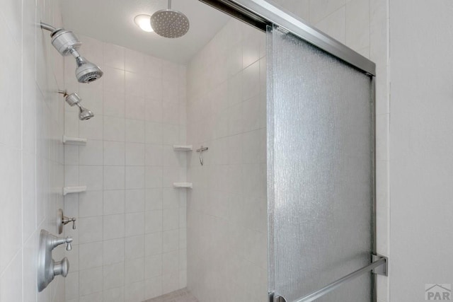 bathroom with a stall shower