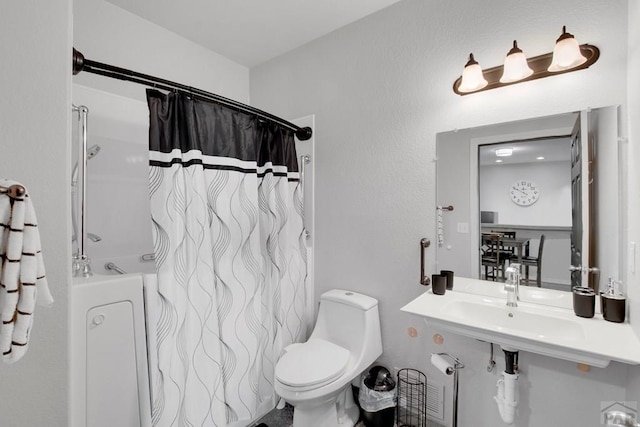 bathroom with toilet and a sink