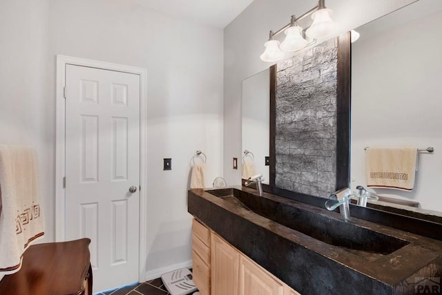 bathroom with vanity and baseboards