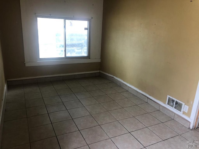 1905 E Evans Ave, Pueblo, CO 81004 - spare room with light tile patterned floors and baseboards