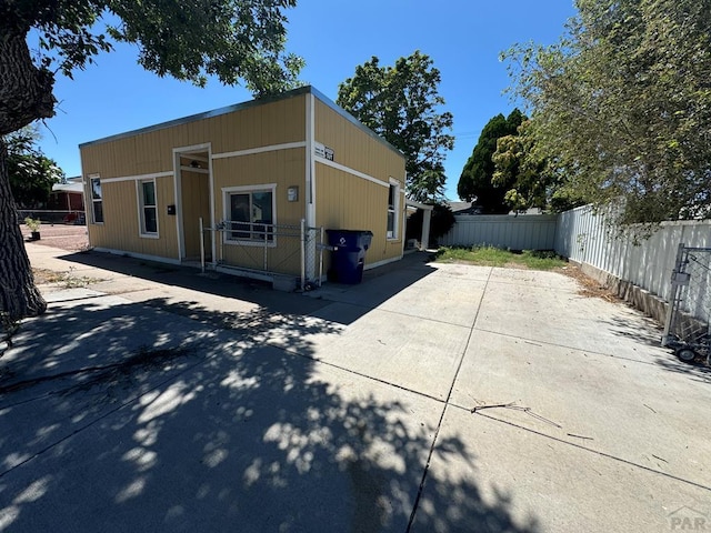 1905 E Evans Ave, Pueblo, CO 81004 - view of front of property featuring driveway and a patio area