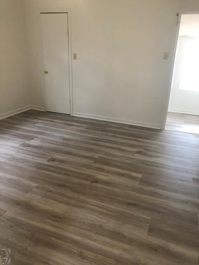 1905 E Evans Ave, Pueblo, CO 81004 - spare room featuring dark wood finished floors and baseboards