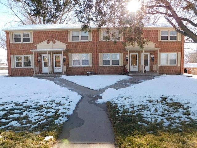 townhome / multi-family property with brick siding