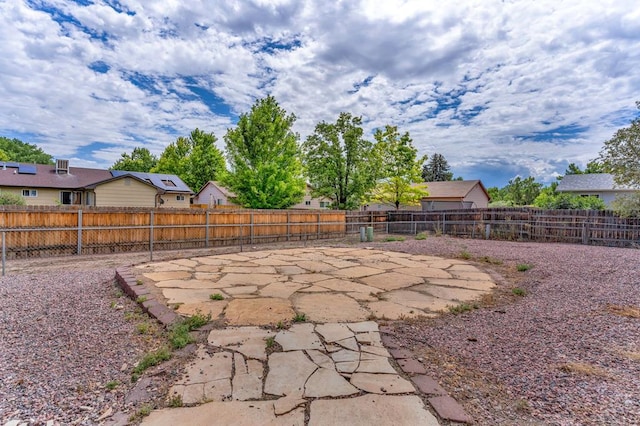 view of yard featuring a patio area and a fenced backyard