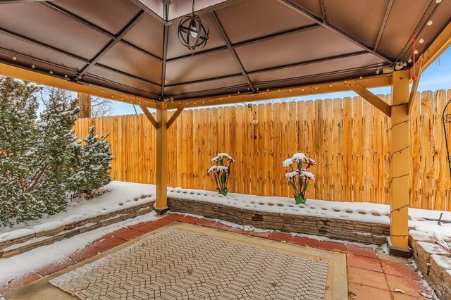 view of patio featuring a gazebo and fence