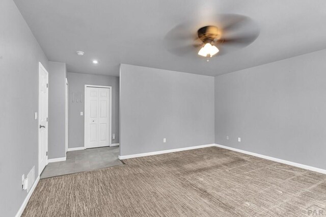 unfurnished room with recessed lighting, carpet, a ceiling fan, and baseboards