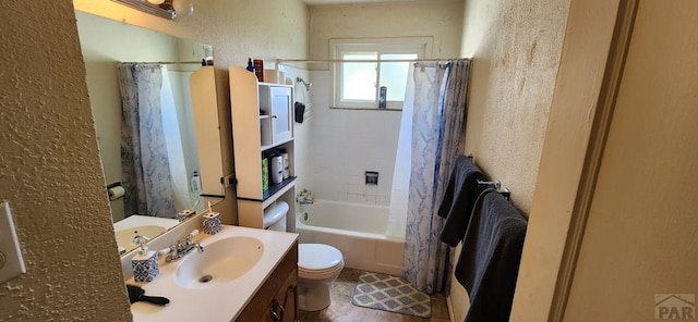 bathroom featuring toilet, vanity, shower / tub combo with curtain, and a textured wall