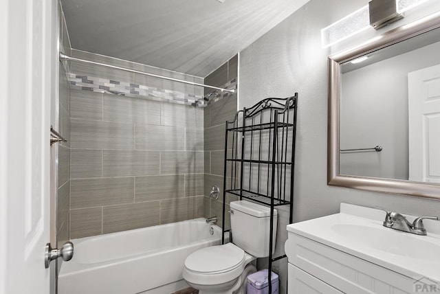 bathroom featuring toilet, shower / bathing tub combination, and vanity