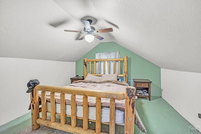 bedroom with lofted ceiling, carpet, ceiling fan, and a textured ceiling