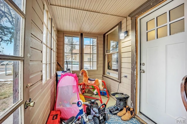 sunroom featuring wooden ceiling