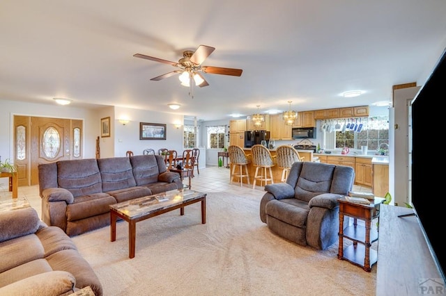 living room featuring a ceiling fan