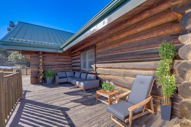 wooden deck featuring an outdoor living space