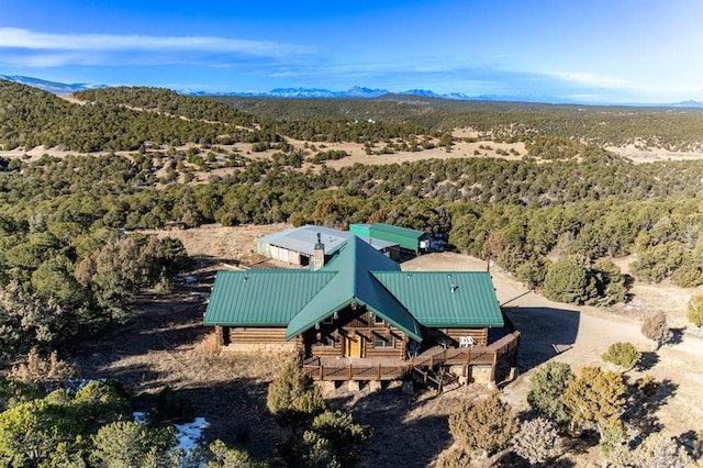 bird's eye view with a view of trees and a mountain view